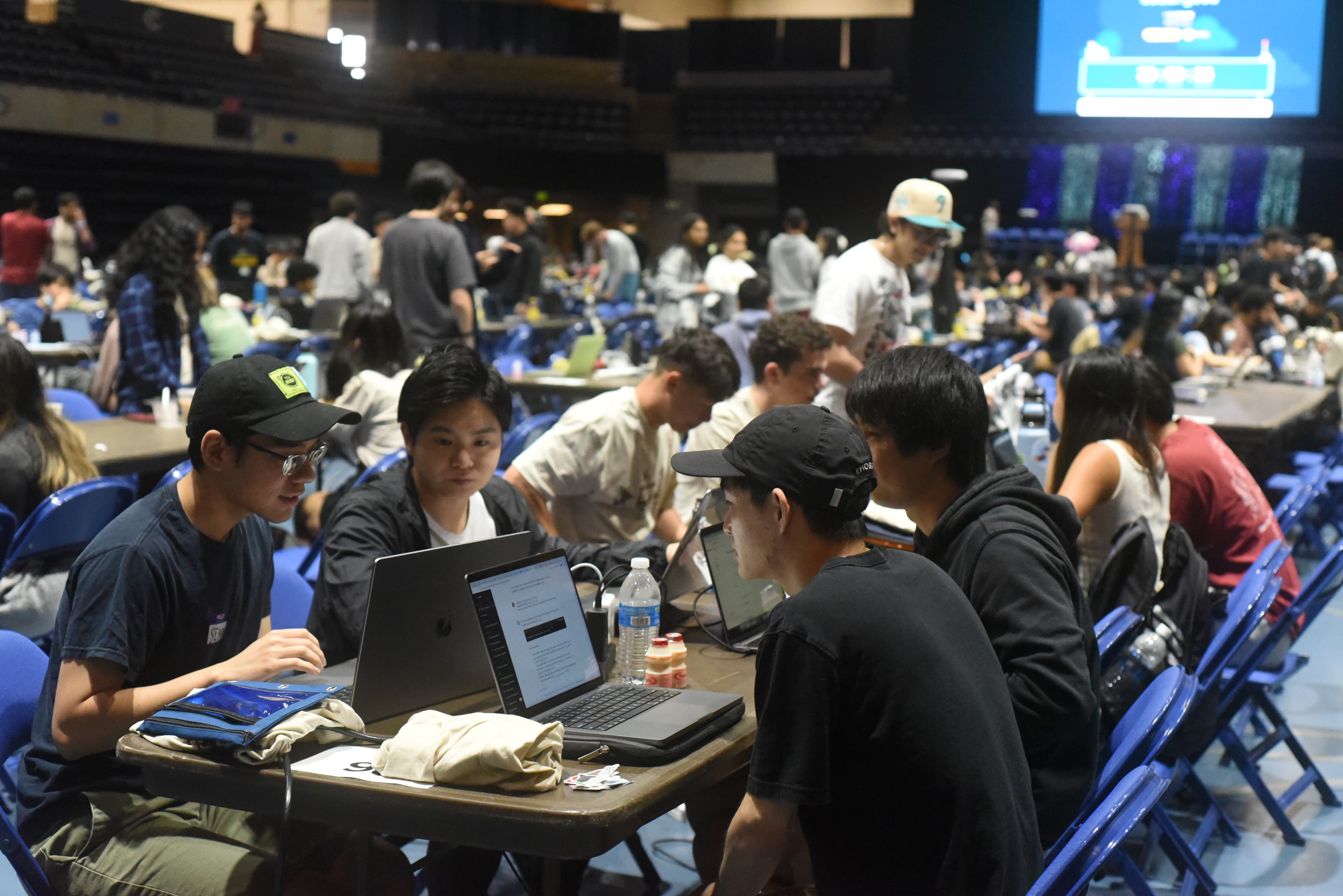 close up of hackers looking at their computers